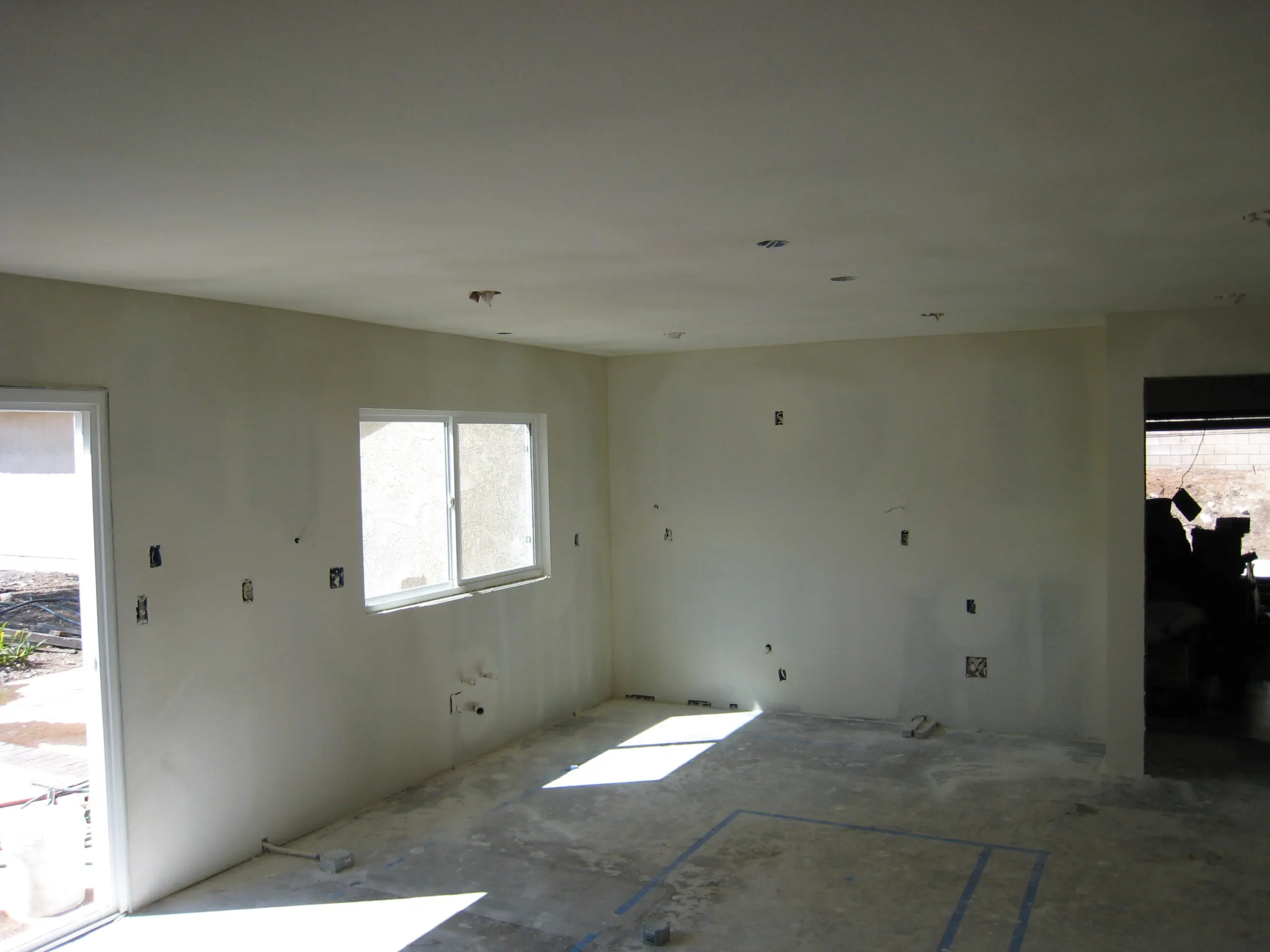Room undergoing drywall installation process