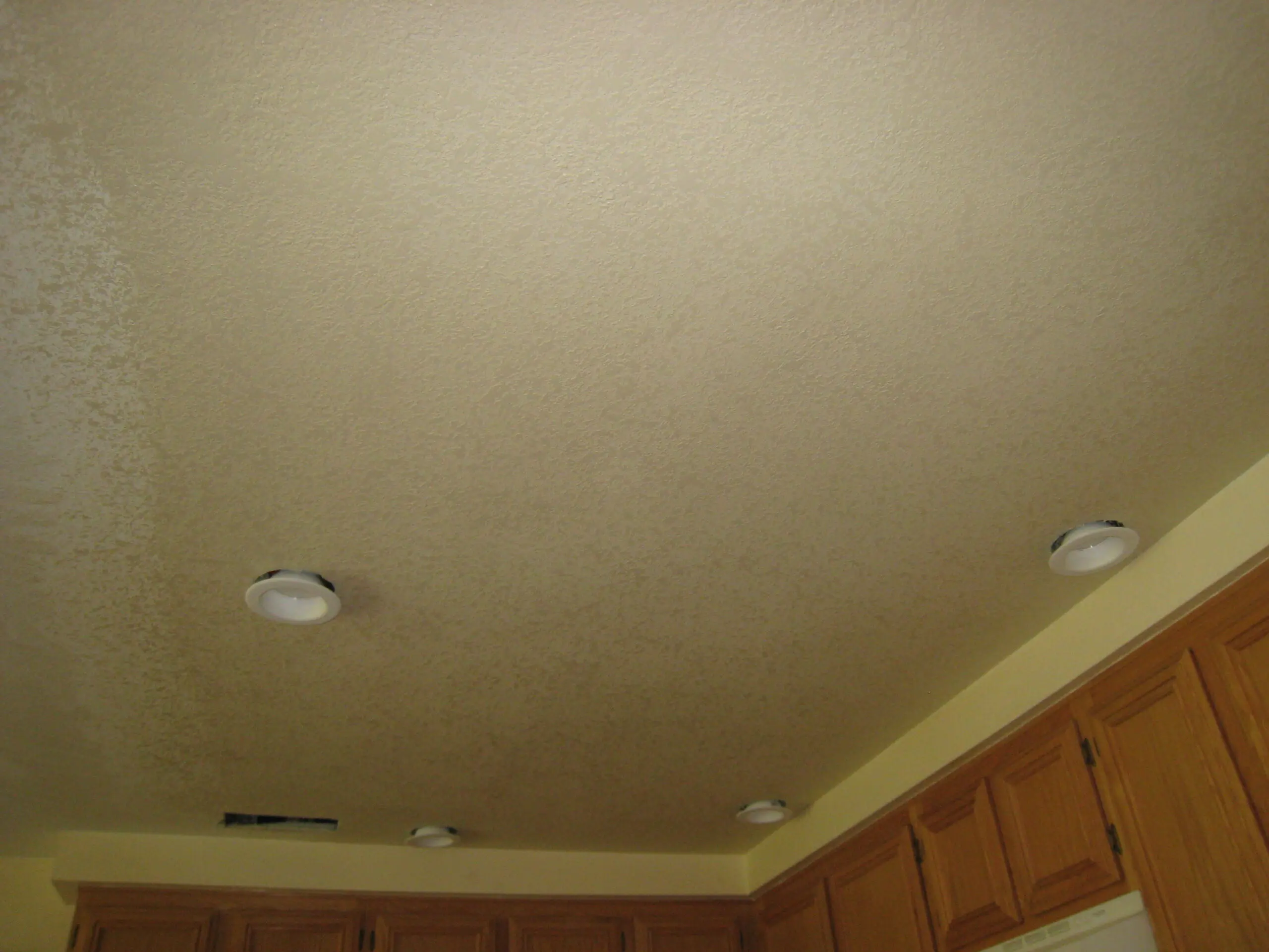 Textured ceiling with recessed lighting