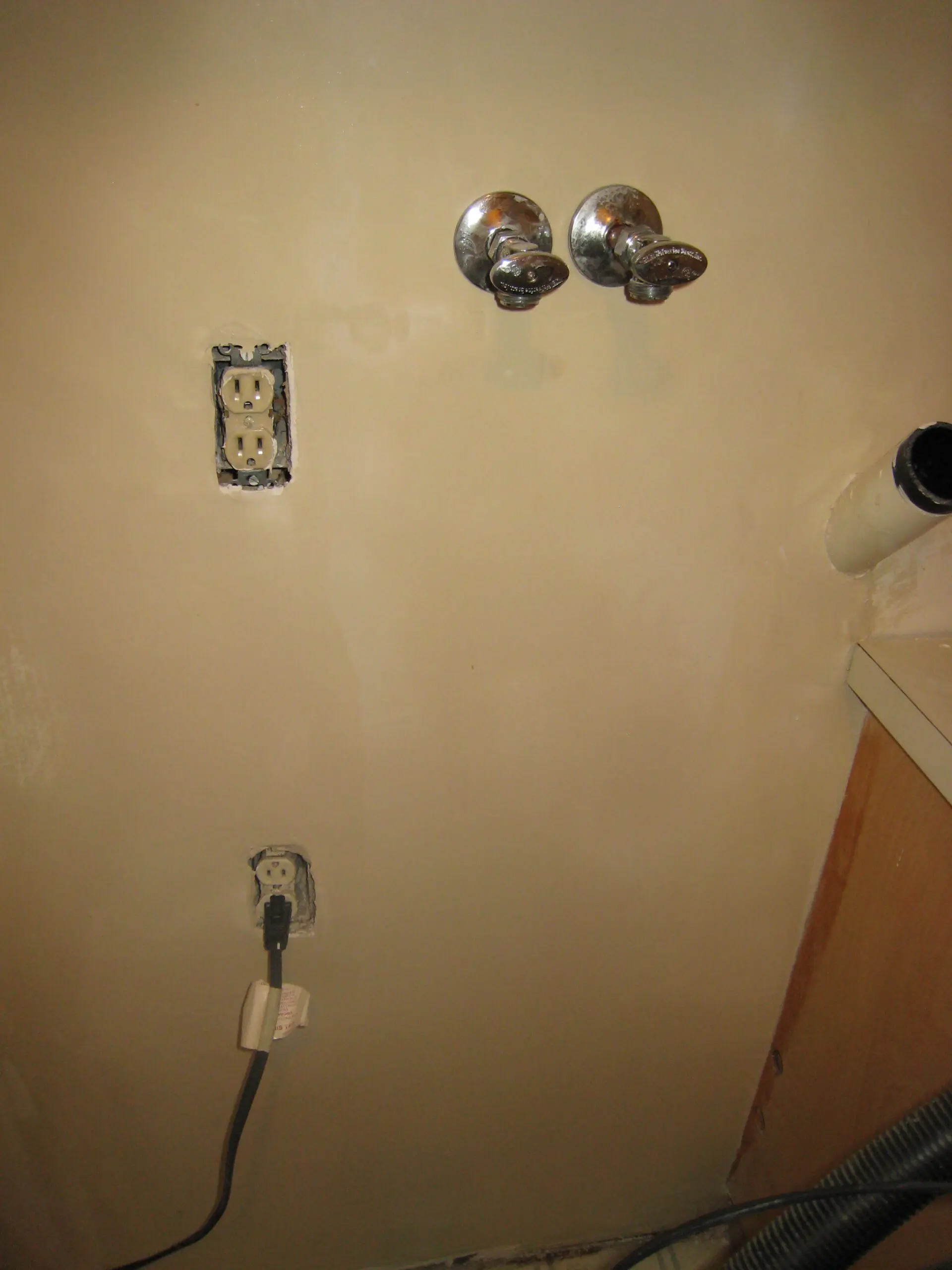Wall with exposed electrical outlets