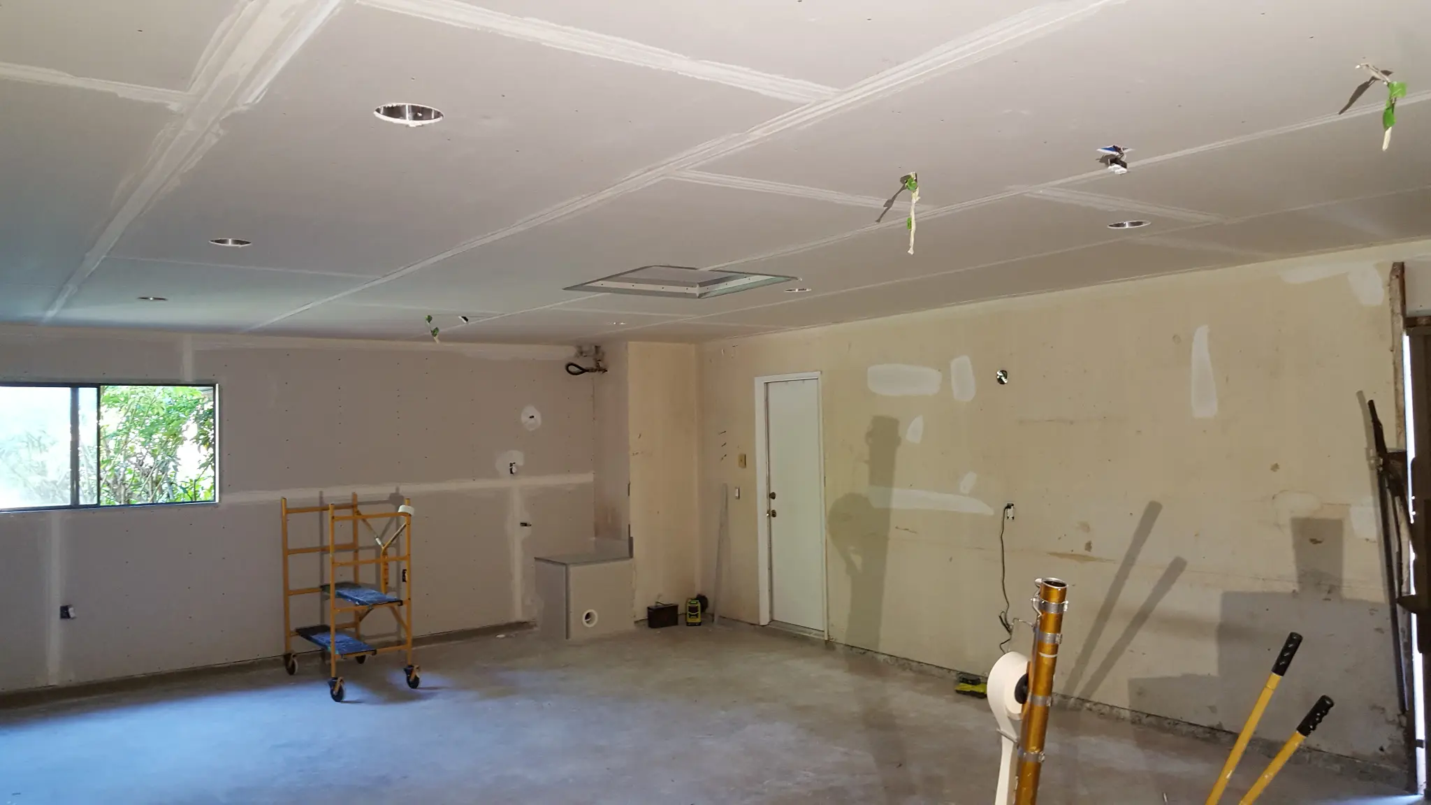 Room drywall installation in progress