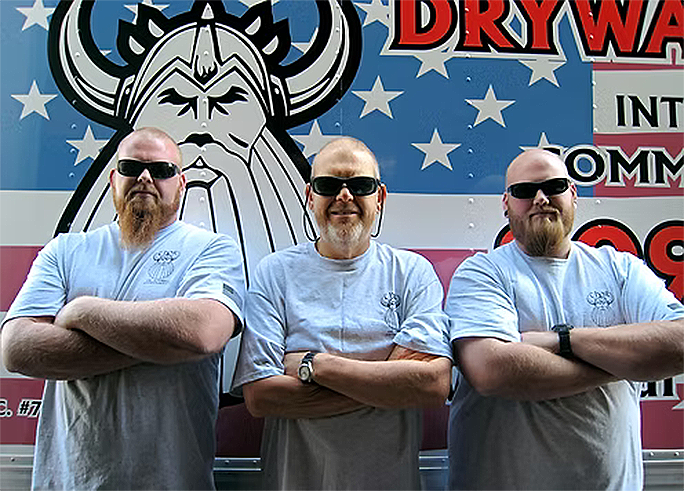 Drywall team in front truck